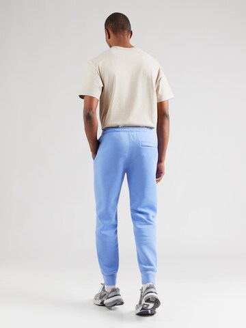 Nike SportswearTapered Hlače 'CLUB' - plava boja