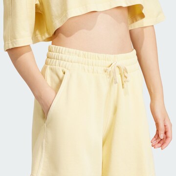 ADIDAS ORIGINALS Lużny krój Spodnie 'Essentials' w kolorze żółty