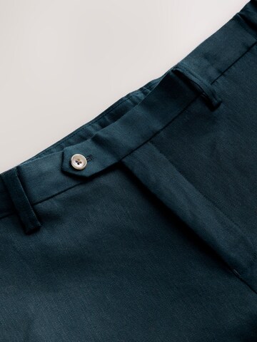 Next Slim fit Trousers with creases 'Motionflex' in Blue