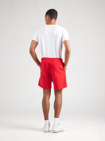 regular Pantaloni di Champion Authentic Athletic Apparel in rosso