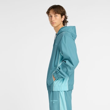 Veste mi-saison 'Trackside Woven Jacket' new balance en bleu