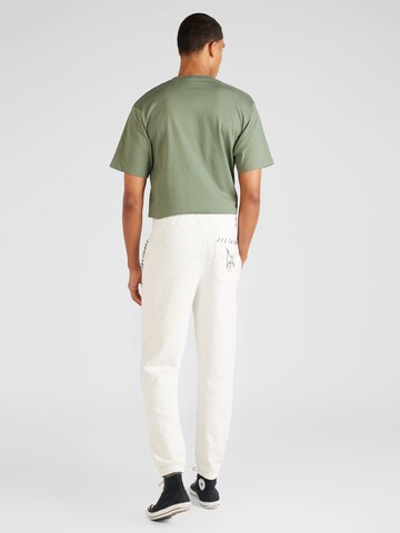 ELLESSE - Tapered Calças de desporto 'Nevica' em branco