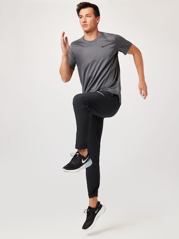 NIKE Regular Workout Pants in Black