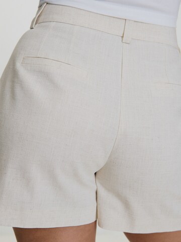 AMI ALY Regular Pleat-front trousers in Beige