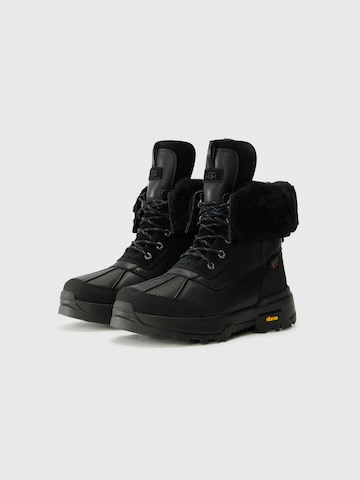 UGG - Botas con cordones 'Adirondack XXV' en negro