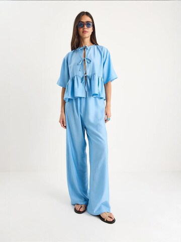 Bianco Lucci - Calças de fato em azul: frente