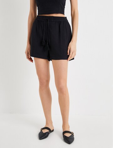 Koton Regular Trousers in Black: front