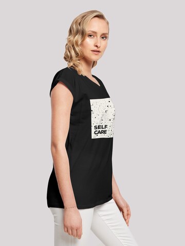 T-shirt 'Self Care' F4NT4STIC en noir