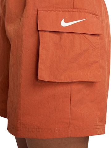 Loosefit Pantaloni cargo 'Essential' di Nike Sportswear in arancione