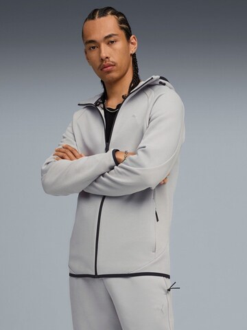 PUMA - Sudadera con cremallera 'Puma Evostripe Fz Hoodie Dk' en gris