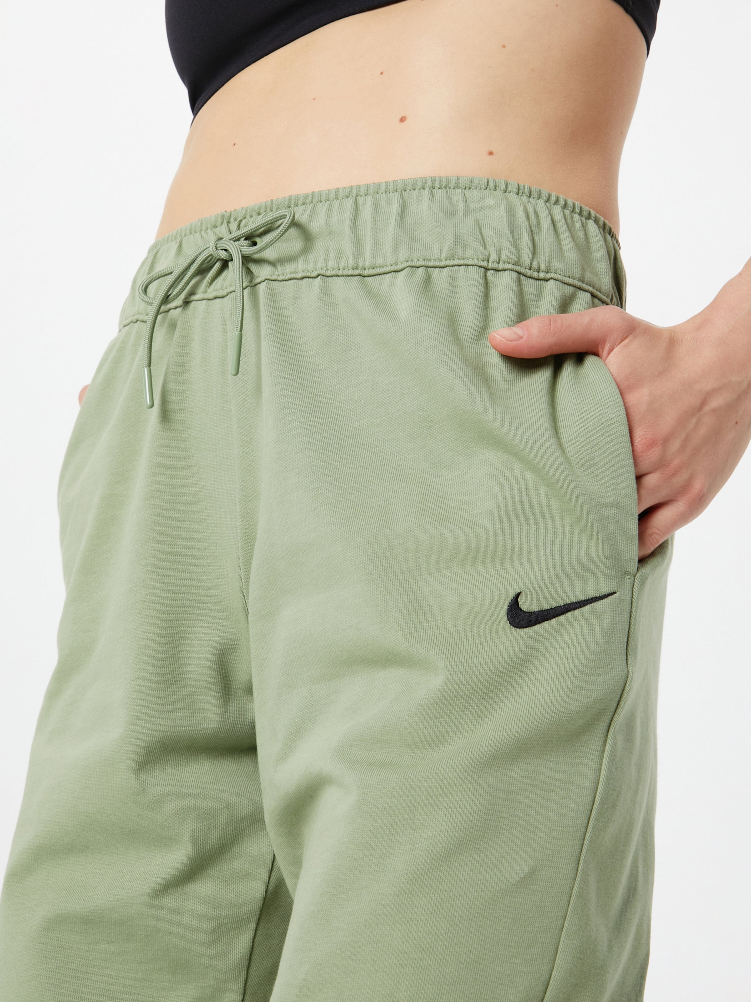 Nike Sportswear Tapered Trousers in Light Green ABOUT YOU