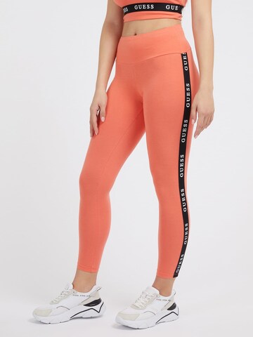 GUESS Skinny Workout Pants in Orange: front