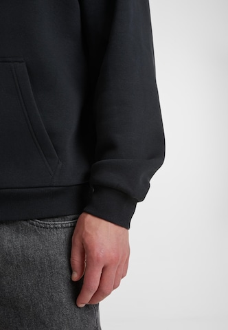 Urban Classics - Sudadera 'Fluffy' en negro