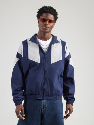 ADIDAS ORIGINALS - Chaqueta de entretiempo en azul: frente