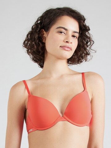 Push-up Reggiseno di PUMA in arancione: frontale