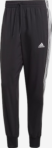 ADIDAS SPORTSWEAR Tapered Sports trousers 'Essentials' in Black: front