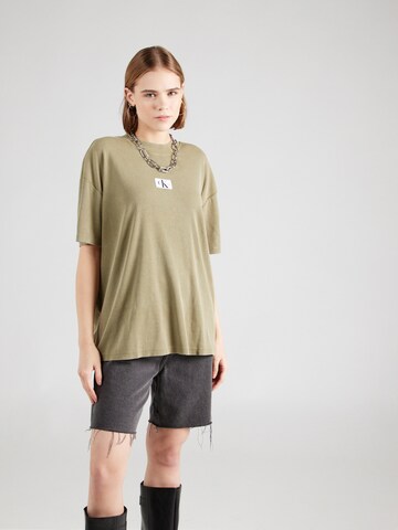 T-shirt Calvin Klein Jeans en vert : devant