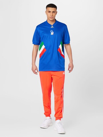 ADIDAS SPORTSWEAR Tapered Sports trousers 'Essentials Warm-Up Tapered 3-Stripes' in Red