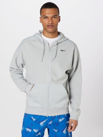 Reebok - Sudadera con cremallera deportiva 'Workout Ready' en gris: frente