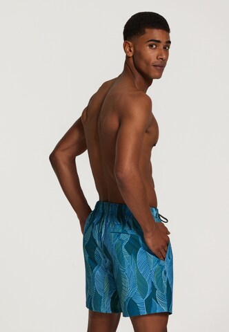 Shiwi Board Shorts 'wild leaves 4-way stretch' in Blau