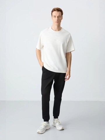 Tuta da jogging di Tommy Life in beige: frontale