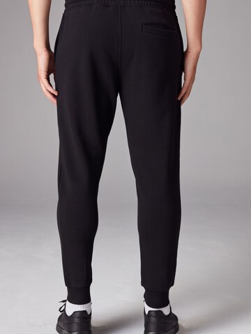 Next Дънки Tapered Leg Панталон в черно