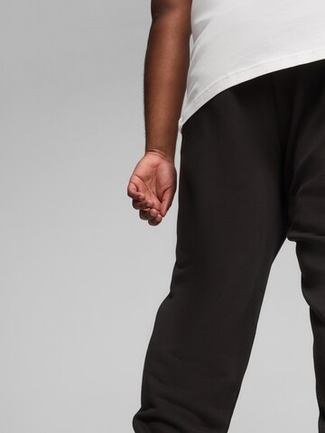 PUMATapered Sportske hlače - crna boja