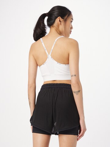 Bustino Reggiseno sportivo di Champion Authentic Athletic Apparel in bianco