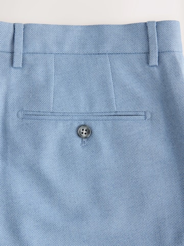 Coupe slim Pantalon à plis Next en bleu