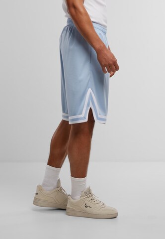 Regular Pantalon 'Small Signature' Karl Kani en bleu