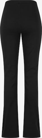 Karl Kani Rozkloszowany krój Spodnie w kolorze czarny