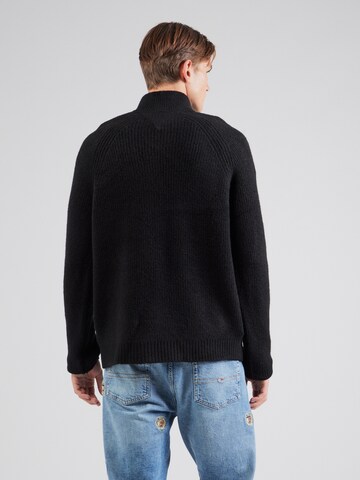 Pull-over Tommy Jeans en noir