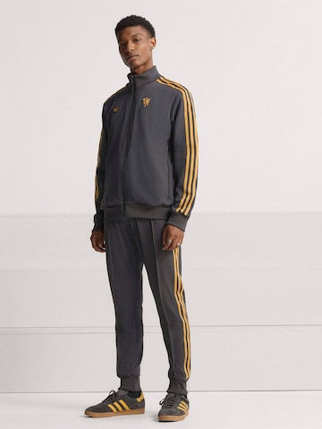ADIDAS ORIGINALS - Sudadera con cremallera deportiva 'Manchester United Terrace Icons' en negro