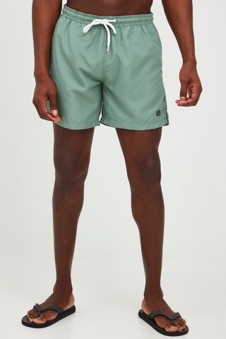 !Solid Board Shorts in Green: front