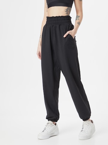 ADIDAS PERFORMANCE Tapered Sports trousers 'Studio' in Black: front