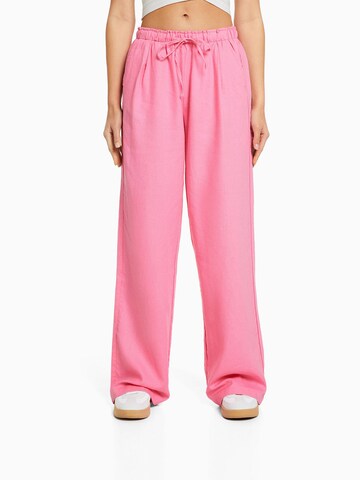 Bershka Wide leg Pants in Pink: front