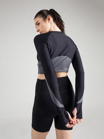 Maglia funzionale di UNDER ARMOUR in nero
