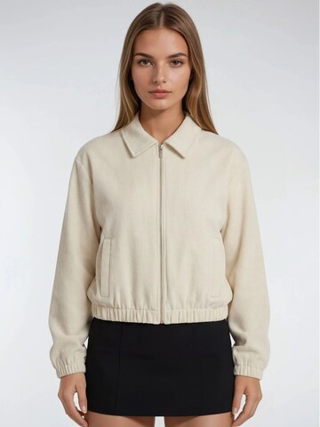 Veste mi-saison MixRay en beige : devant