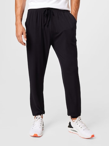 CURARE Yogawear Tapered Sportbroek in Zwart: voorkant