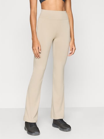 Evazați Pantaloni sport de la Champion Authentic Athletic Apparel pe bej: față