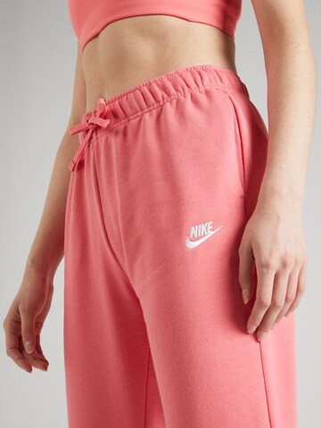 oranžinė Nike Sportswear Siaurėjantis Kelnės