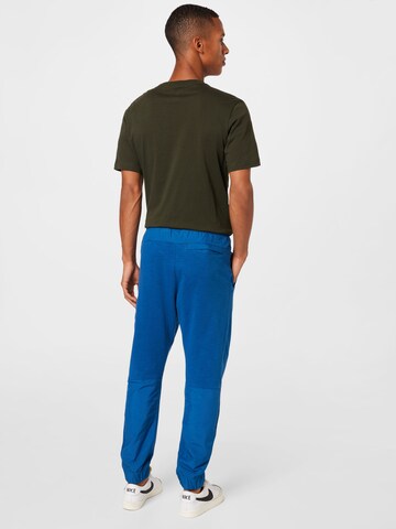 Nike Sportswear Tapered Trousers in Blue