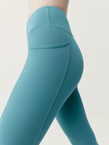 Born Living Yoga Skinny Sportbroek 'Carole' in Blauw
