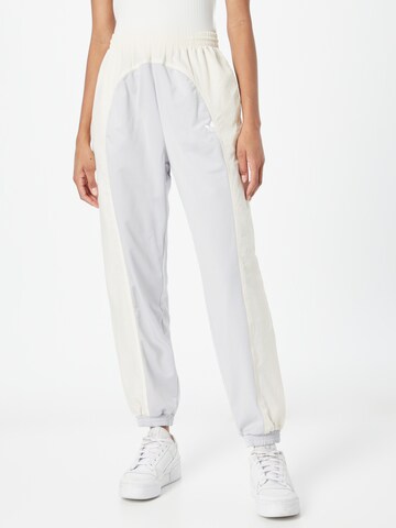 ADIDAS ORIGINALS Tapered Trousers in White: front