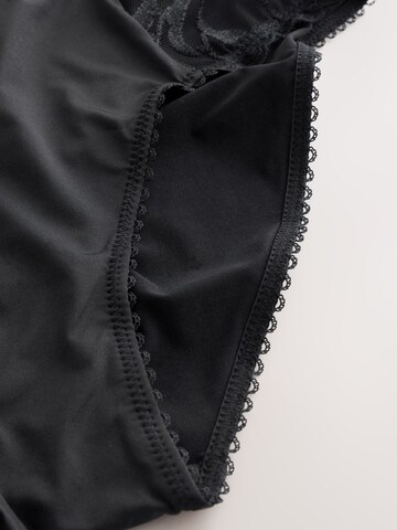 melns Next Biksītes