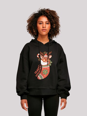Sweat-shirt 'Groovy Christmas Hippie Reindeer' F4NT4STIC en noir : devant