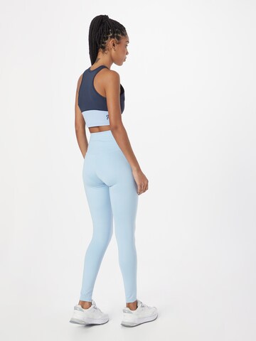 Girlfriend Collective Skinny Sporthose in Blau