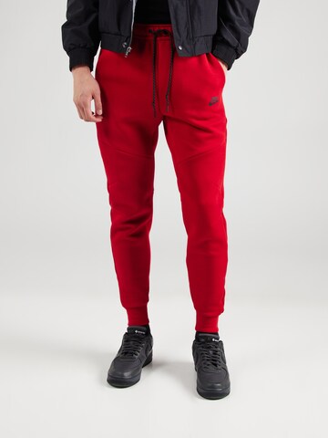 Effilé Pantalon 'TCH FLC' Nike Sportswear en rouge : devant