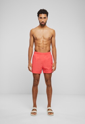 regular Pantaloni di Karl Kani in rosso