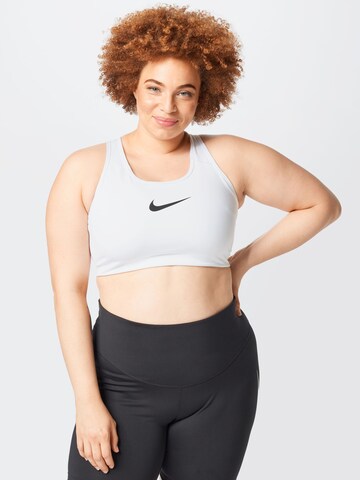 Nike Sportswear Regular Sports Bra 'Swoosh' in White: front